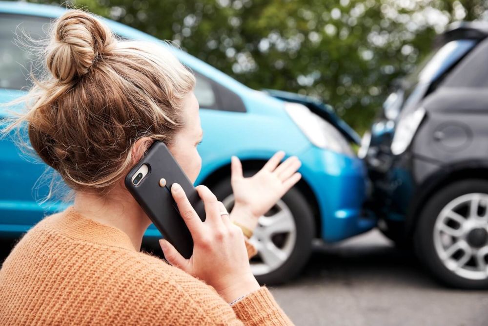 woman on phone after cat accident