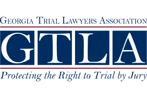 Logo of Georgia Trial Lawyers Association with slogan Protecting the Right to Trial by Jury in blue and red text.