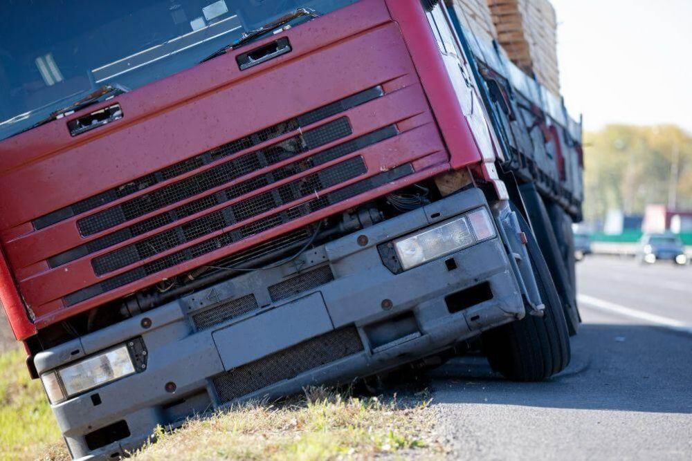 Red truck damaged on the side of a Georgia road