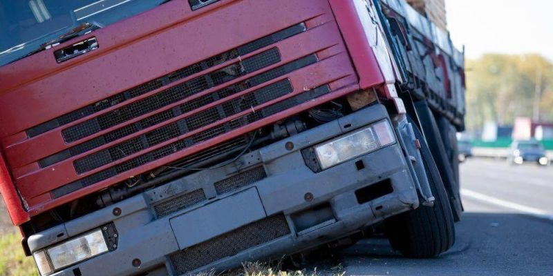 Red truck damaged on the side of a Georgia road